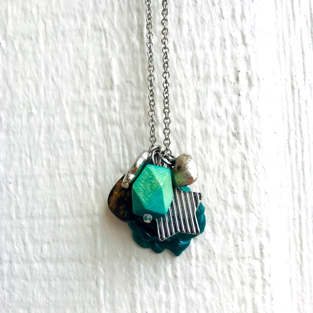 Necklace with green stones and charms